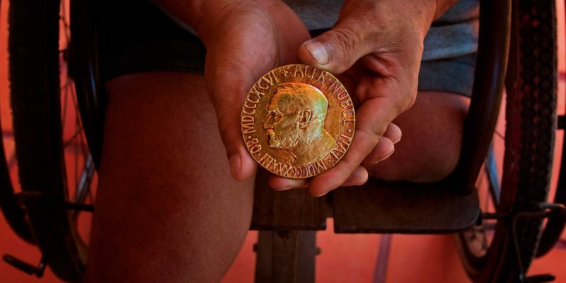 Thun "Reth" Channareth holds the Nobel Peace Prize awarded to the ICBL in 1997 for their efforts in achiving the Land Mine Ban (Ottawa Treaty). Photo: Heather Faulkner